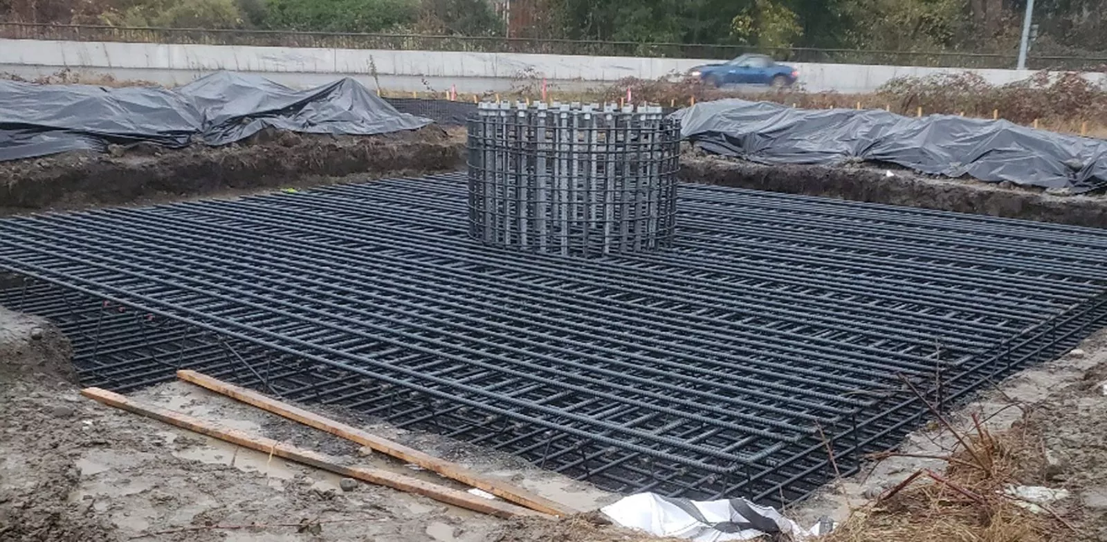 Rebar footing mat with anchor bolt cage
