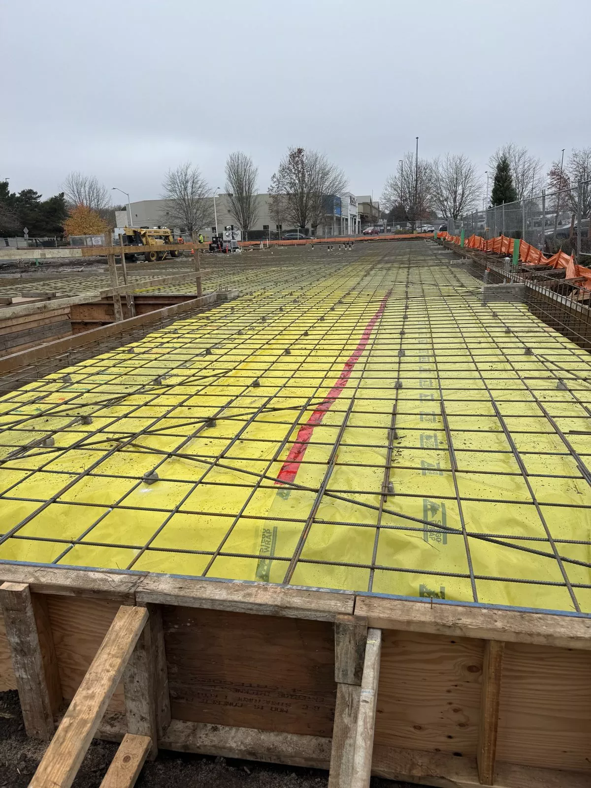 Slab-on-grade rebar mat over vapor barrier